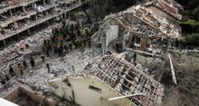 Equipes de resgate e segurança trabalham em local afetado após ataque de mísseis do Irã, em Tel Aviv