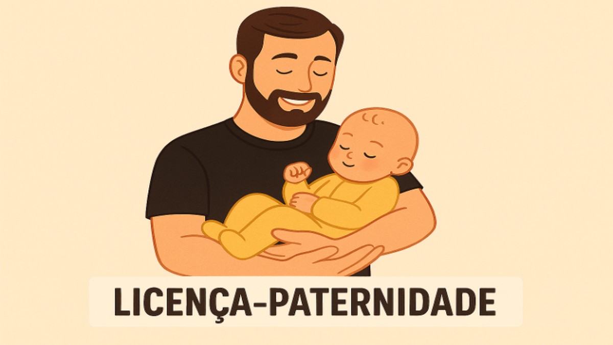 Pai segura criança no colo.