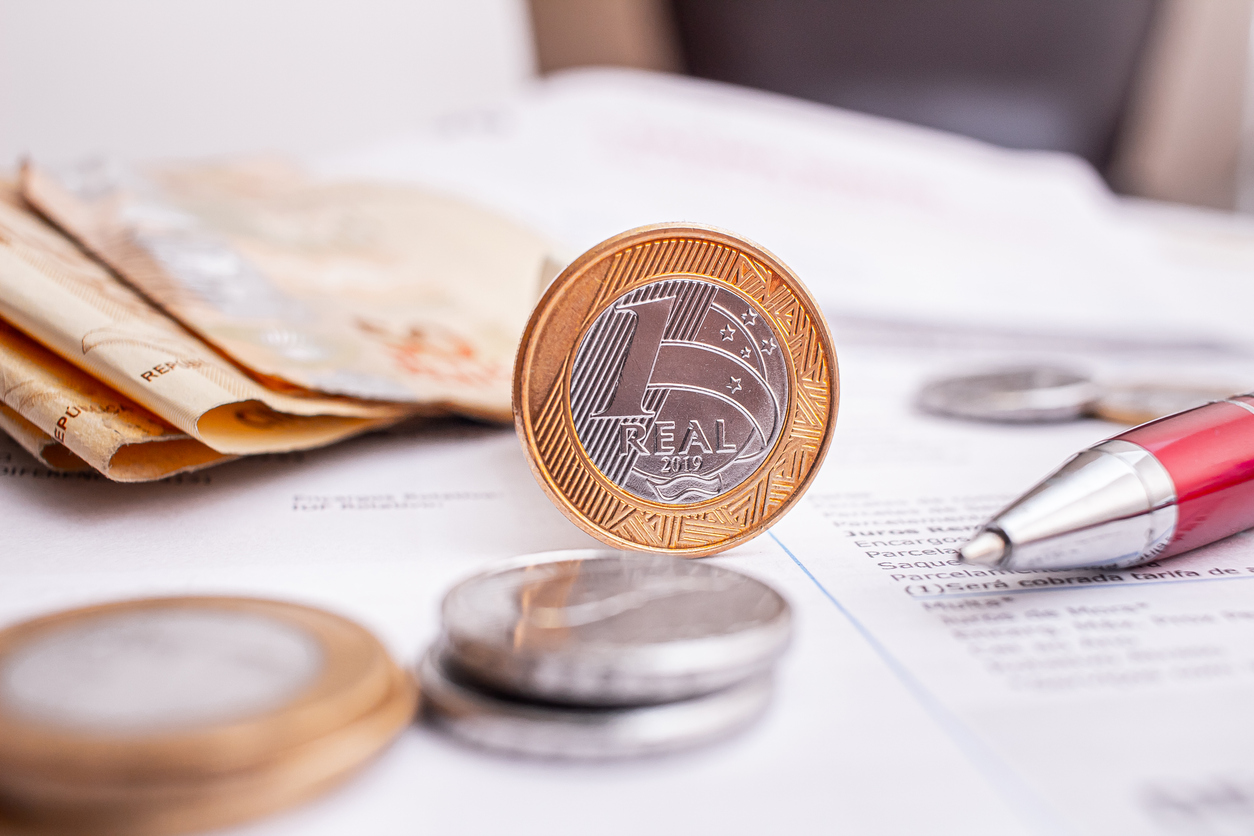 Real - Brazilian Currency. Money from Brazil. Real coins and Real banknotes on a white paper.