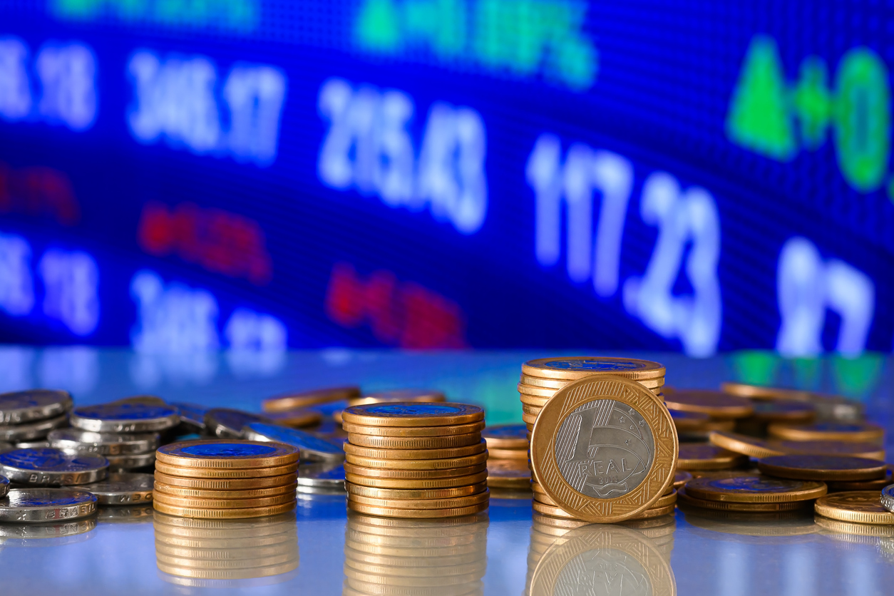 stack of coins forming a bar chart on a graph, investment concept, financial market