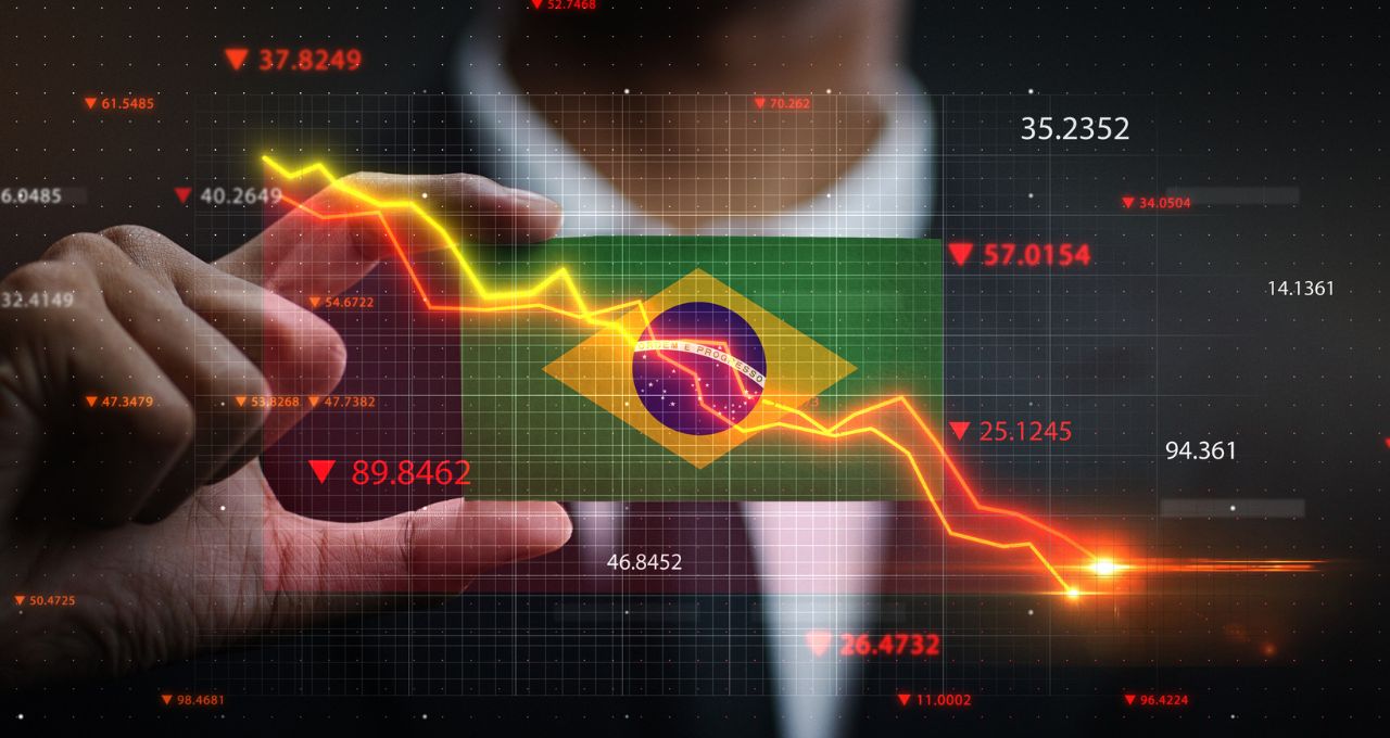 Foto de stock de Gráfico caindo na frente da bandeira do Brasil. Conceito de Crise